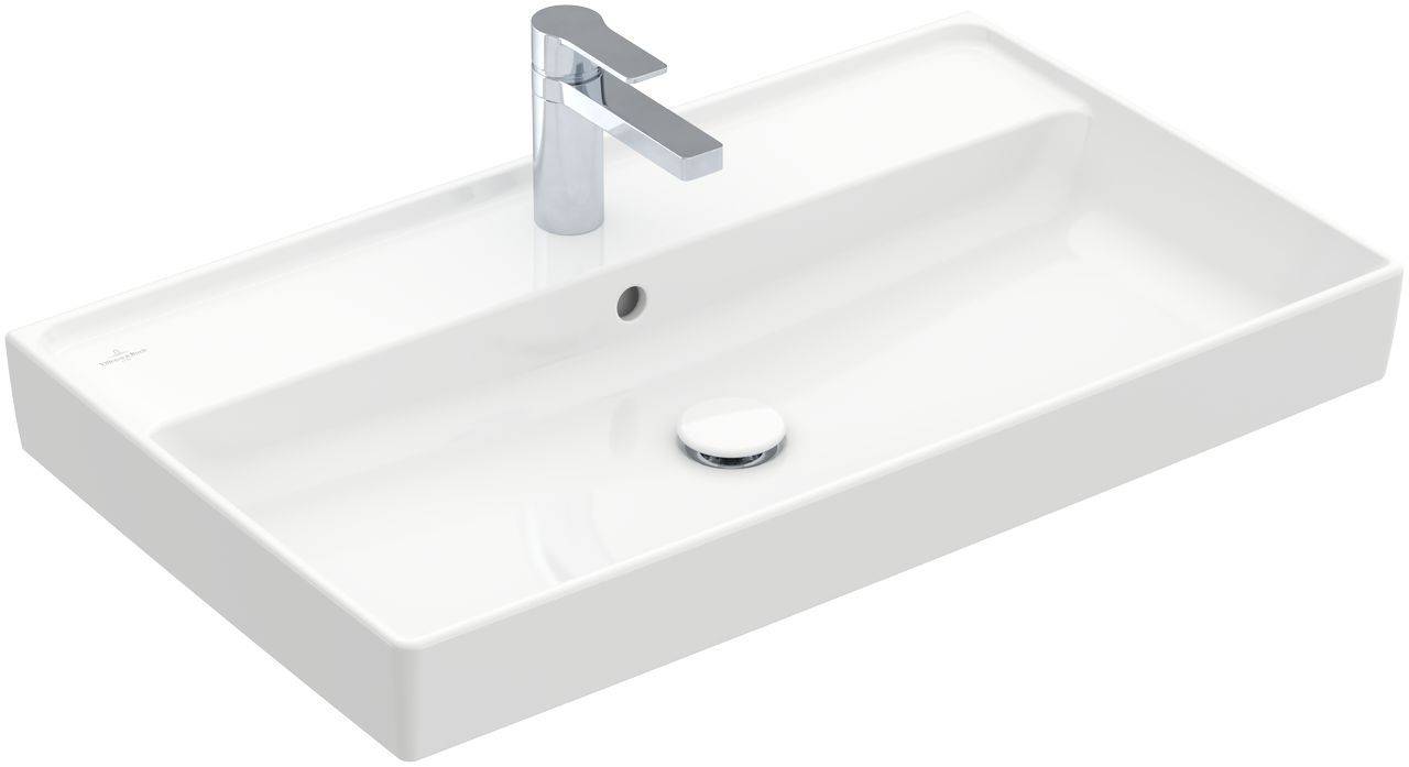 Weißes Waschbecken mit integriertem Wasserhahn und Ablauf